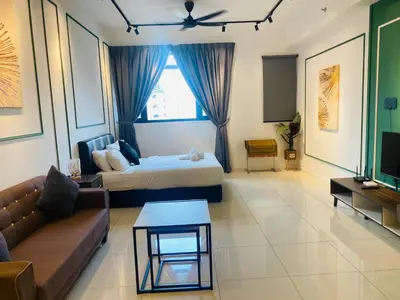 a living room with a bed and a couch at Chambers Residences ZFJ World in Kuala Lumpur