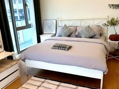a bedroom with a large white bed with pillows at Bintang Fairlane Residence, KLCC & City Skyline View -2B1R in Kuala Lumpur