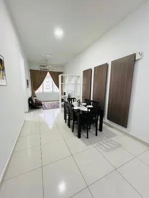 a dining room with a table and chairs at klcc view VUE residences Hkl 2 in Kuala Lumpur