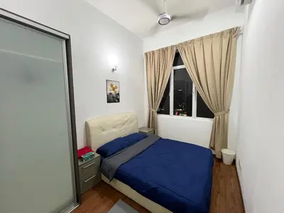 a bedroom with a bed and a window at klcc view VUE residences Hkl 2 in Kuala Lumpur