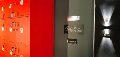 a room with red and green walls and a mirror at Guesthouse@ Bukit Bintang in Kuala Lumpur