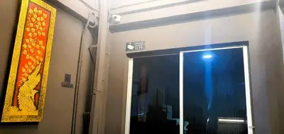 a door to a room with a window and a sign at Guesthouse@ Bukit Bintang in Kuala Lumpur