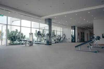 a gym with treadmills and machines in a building at Sfera Residence Kuala Lumpur City Centre in Kuala Lumpur