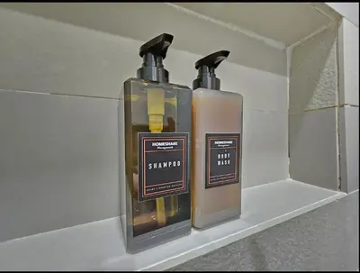 two bottles of soap are sitting on a shelf at KL City Suites 2-4pax near KLCC & Bukit Bintang in Kuala Lumpur