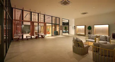 a large living room with couches and tables and windows at M Vertica KL City in Kuala Lumpur