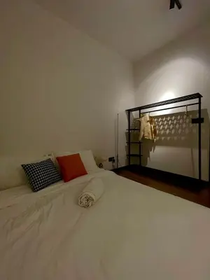 a bedroom with a large white bed with two pillows at M Vertica KL City in Kuala Lumpur