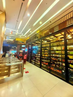a grocery store with people standing in the aisle at Summer Suites KLCC By Palace in Kuala Lumpur