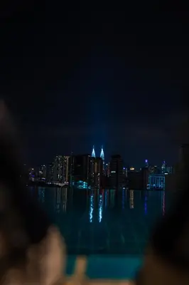 a view of a city skyline at night at Infinite Pool! Room in Kuala Lumpur in Kuala Lumpur