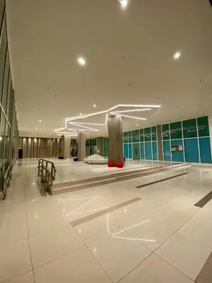 a lobby of a building with a large white floor at Infinite Pool! Room in Kuala Lumpur in Kuala Lumpur