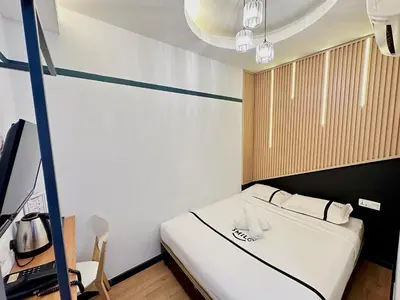 a small room with a bed and a desk at Seeds Hotel Setia Wangsa in Kuala Lumpur