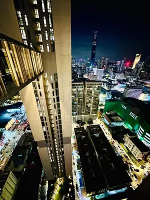 a view of a city at night from a skyscraper at Axon Infinity Pool KL in Kuala Lumpur