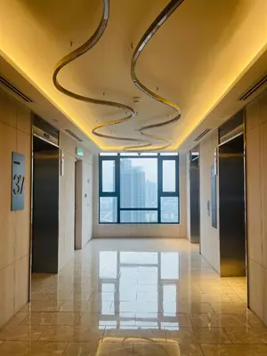 a hallway of an office building with curved ceilings at Axon Infinity Pool KL in Kuala Lumpur