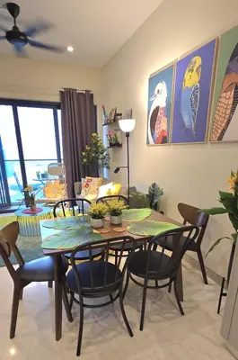 a living room with a dining room table and chairs at Springtime 2bedrooms with KLCC view &Gorgeous pool in Kuala Lumpur