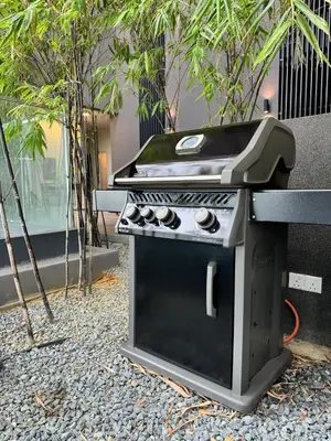 a barbecue grill sitting on top of a table at Springtime 2bedrooms with KLCC view &Gorgeous pool in Kuala Lumpur