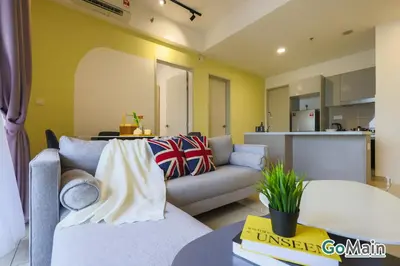 a living room with a couch and a kitchen at Free Parking - Big Suite Trion Kuala Lumpur by GoMain in Kuala Lumpur