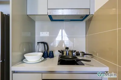 a kitchen with a stove with a pot and a bowl at Free Parking - Big Suite Trion Kuala Lumpur by GoMain in Kuala Lumpur