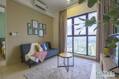 a living room with a blue couch and a large window at Free Parking - Big Suite Trion Kuala Lumpur by GoMain in Kuala Lumpur