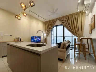 a kitchen with a sink and a living room at NJ Homestay AT TRION, KL in Kuala Lumpur
