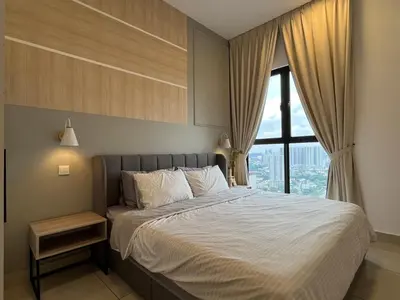 a bedroom with a large bed with a window at NJ Homestay AT TRION, KL in Kuala Lumpur