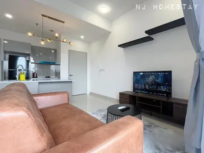 a living room with a couch and a tv at NJ Homestay AT TRION, KL in Kuala Lumpur