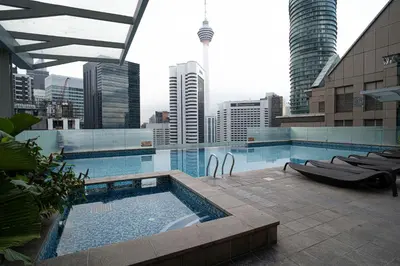 a swimming pool on top of a building with a city at Studio, 6 Pax, 3mins to KLCC (3A01_2) in Kuala Lumpur