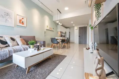 a living room with a couch and a table at Continew Residensi by Feel Home in Kuala Lumpur