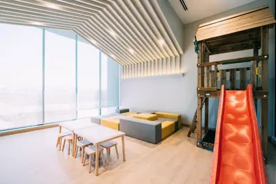 a room with a loft bed and a table and chairs at Continew Residensi by Feel Home in Kuala Lumpur