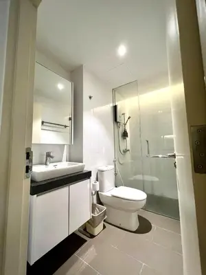 a bathroom with a toilet and a sink and a shower at The EST Bangsar Kuala Lumpur in Kuala Lumpur