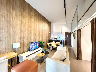 a living room with a couch and a table at The EST Bangsar Kuala Lumpur in Kuala Lumpur