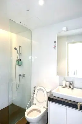 a bathroom with a toilet and a shower and a sink at The EST Bangsar Kuala Lumpur in Kuala Lumpur