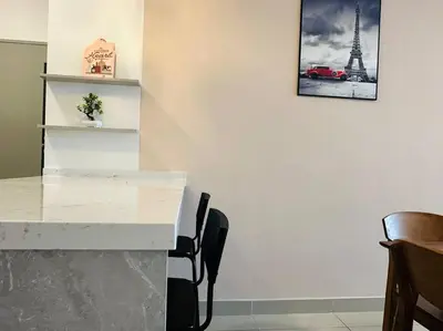 a white table with chairs and a picture of the eiffel tower at MVD19#Family Suite 8pax 3 Rooms M Vertica Velocity Mall Cheras IKEA Mytown Short Walk to MRT & LRT Maluri in Kuala Lumpur