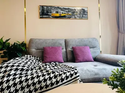 a living room with a couch and purple pillows at MVD19#Family Suite 8pax 3 Rooms M Vertica Velocity Mall Cheras IKEA Mytown Short Walk to MRT & LRT Maluri in Kuala Lumpur