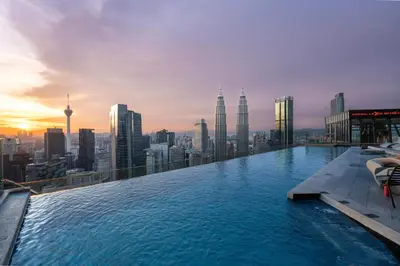 a infinity pool on the top of a skyscraper at Imperial Luxury Suites KLCC by Moonway in Kuala Lumpur