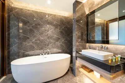 a bathroom with a white tub and a sink at Imperial Luxury Suites KLCC by Moonway in Kuala Lumpur