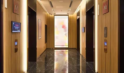 an empty hallway in a building with a door at Imperial Luxury Suites KLCC by Moonway in Kuala Lumpur