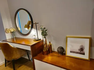 a desk with a mirror and a picture on it at Stylish Ceylonz Suite near Bukit Bintang 4pax in Kuala Lumpur