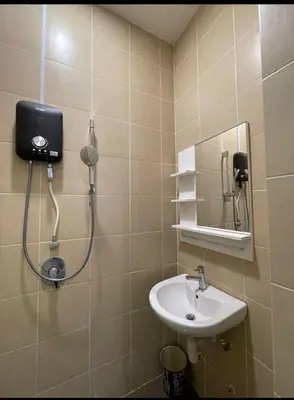 a bathroom with a shower and a sink at Cozy home in city center with free parking -1B in Kuala Lumpur