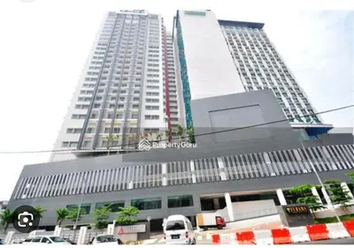 a large building with cars parked in front of it at Cozy home in city center with free parking -1B in Kuala Lumpur