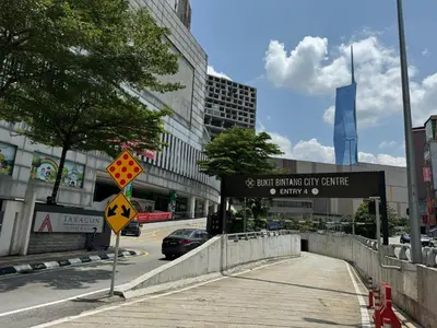 a street sign on a sidewalk in a city at Cozy home in city center with free parking -1B in Kuala Lumpur