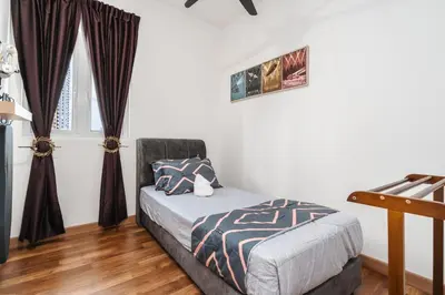 a bedroom with a bed and a window at Sentul Homestay 3 Bedroom in Kuala Lumpur