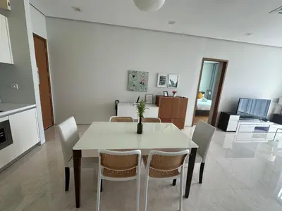 a dining room with a white table and chairs at Soho Suites KLCC 20 jalan perak in Kuala Lumpur