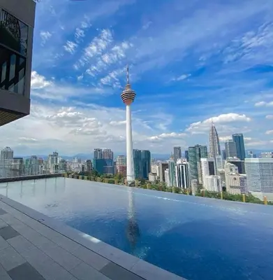 a swimming pool with a view of a city skyline at Ceylonz Suites By Staybliss in Kuala Lumpur