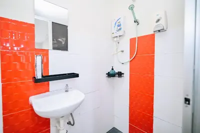 a bathroom with a sink and a shower at Swing & Pillows - My Home Hotel Wangsa Maju in Kuala Lumpur