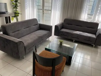 a living room with two couches and a coffee table at Couple Suite For Bukit Bintang S/R in Kuala Lumpur