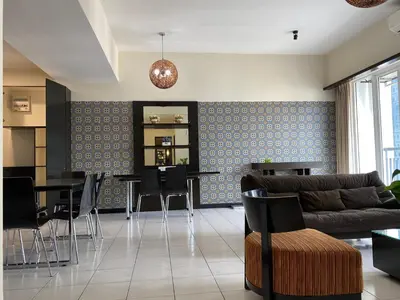a living room with a couch and a table at Couple Suite For Bukit Bintang S/R in Kuala Lumpur