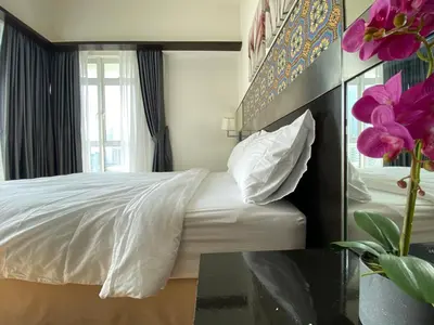 a bedroom with a white bed and a window at Couple Suite For Bukit Bintang S/R in Kuala Lumpur