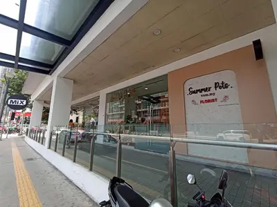 a scooter parked in front of a shopping mall at D'Majestic Place, 1 King or 2 Super Single beds in Kuala Lumpur