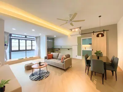 a living room with a couch and a table at KAĨTE Homestay at Fahrenheit88 Bukit Bintang in Kuala Lumpur
