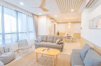 a living room with a couch and a table at KL Gateway Residences in Kuala Lumpur