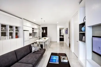 a living room with a couch and a television at The Platinum Kuala Lumpur KLCC By Garden Suites in Kuala Lumpur